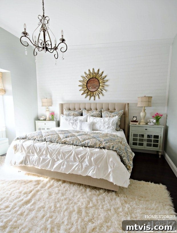 Master bedroom makeover by Home Stories A to Z featuring a beautiful DIY plank accent wall and a serene gray color palette with rich textures.