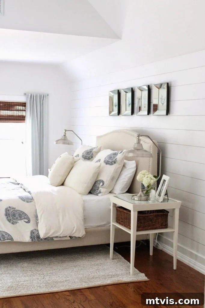 Bright and serene master bedroom makeover by The Picket Fence Projects, showcasing resourceful decor finds from garage sales and Overstock.com.
