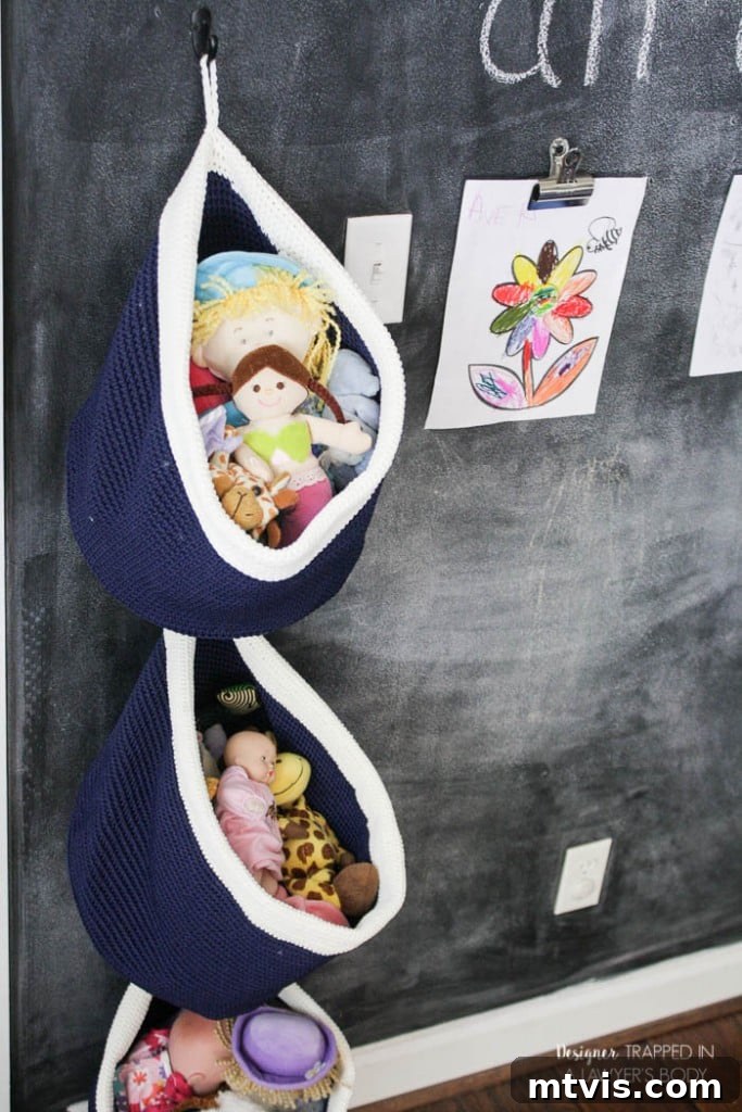 The Ultimate Ikea Lego Table Hack 16 This is BRILLIANT and so easy! Use baskets for easy, DIY hanging toy storage in any kid's space! Full tutorial by Designer Trapped in a Lawyer's Body.