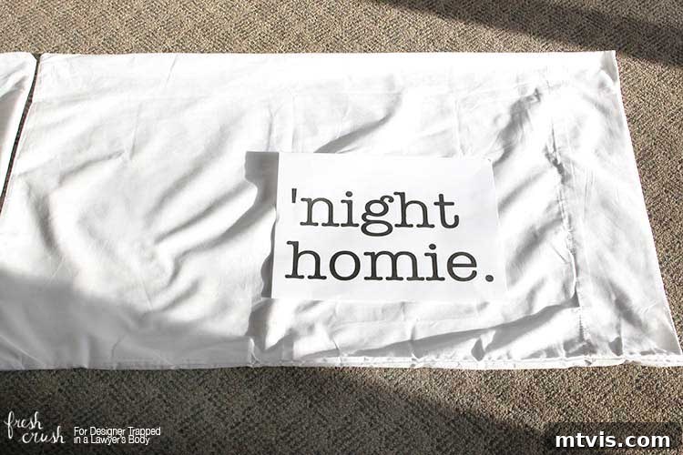 Planning the design for a personalized pillowcase, printing 'Goodnight Homie' on plain paper to check size and placement.