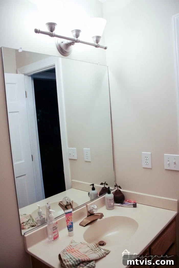 Learn how our DIY concrete vanity is holding up 18 months after completion! / DIY concrete counter top / DIY concrete sink / designertrapped.com