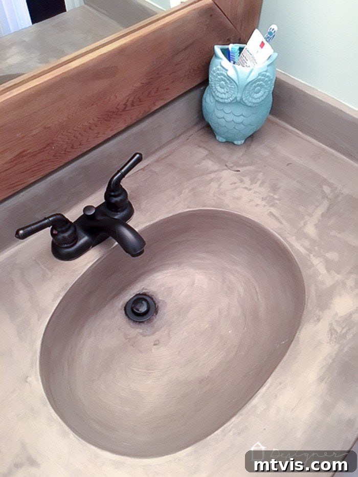 Learn how our DIY concrete vanity is holding up 18 months after completion! / DIY concrete counter top / DIY concrete sink / designertrapped.com