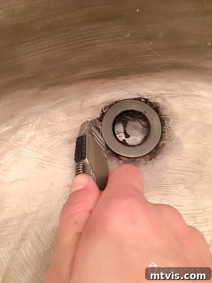Learn how our DIY concrete vanity is holding up 18 months after completion! / DIY concrete counter top / DIY concrete sink / designertrapped.com