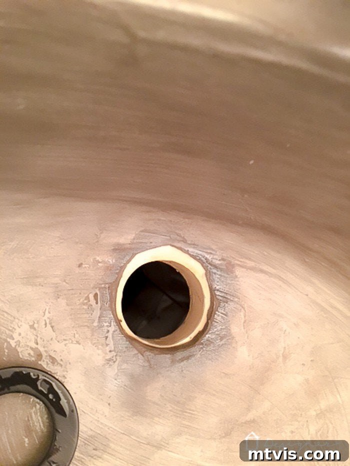 Learn how our DIY concrete vanity is holding up 18 months after completion! / DIY concrete counter top / DIY concrete sink / designertrapped.com