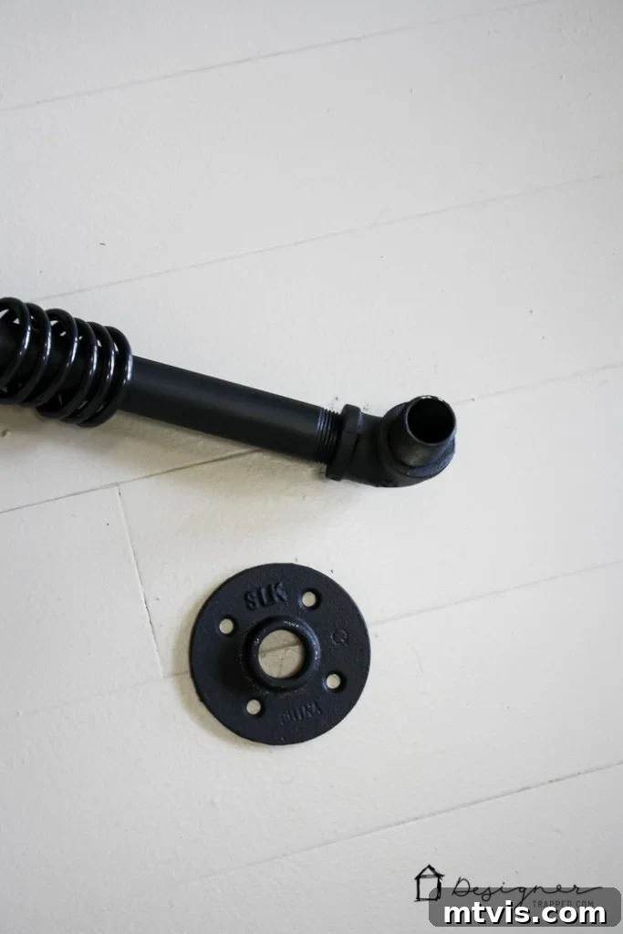 Craft Your Own Unique Curtain Rod 5 Attaching nipples and floor flanges to complete the DIY pipe curtain rod assembly