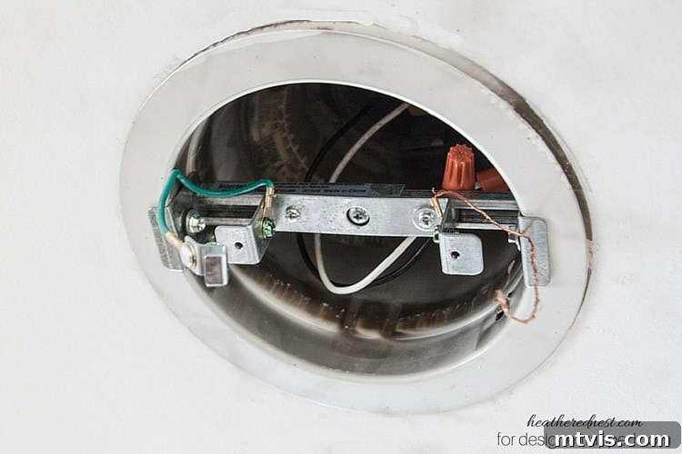 Elevate Your Lighting: Recessed to Pendant Conversion 10 Identify the green and bare copper ground wires on the lighting support for proper electrical connection.