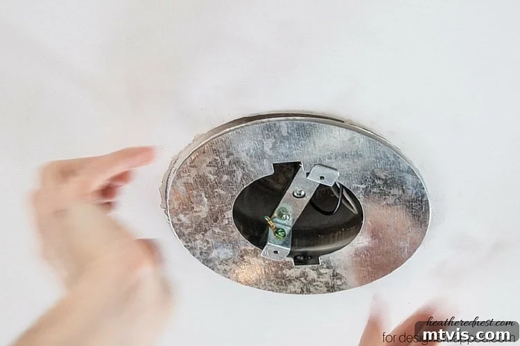 Elevate Your Lighting: Recessed to Pendant Conversion 11 Install the ceiling medallion over the metal backer for a finished look around your new pendant light.