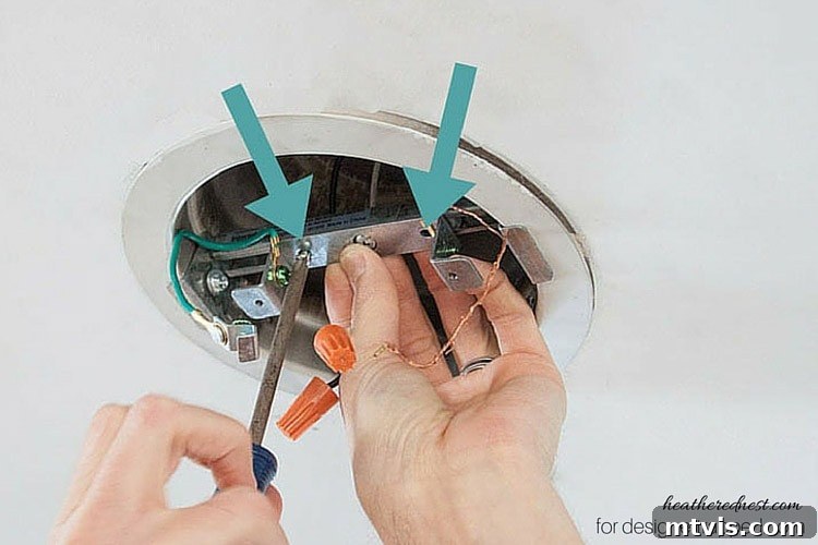 Elevate Your Lighting: Recessed to Pendant Conversion 9 Attach the lighting support bracket to the cross brace for your new pendant light.