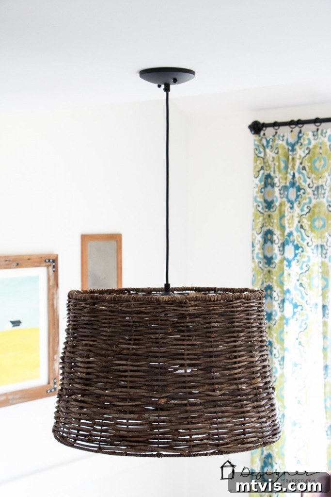 Light Up Your Space Effortlessly 8 Beautifully installed DIY pendant light with a large, stylish lampshade, illuminating a dining area with a modern aesthetic.