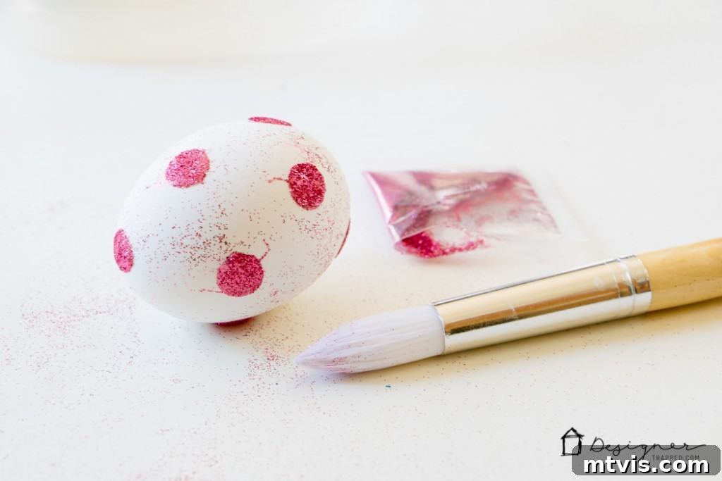 Sparkle and Spot: Creative Easter Egg Decorating 6 Applying glitter to create a sparkling dot pattern on an Easter egg