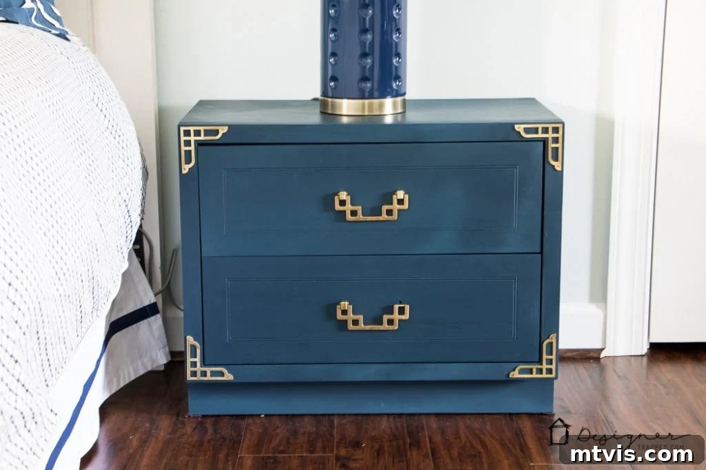 Campaign Nightstand Revival 11 Beautifully transformed navy blue campaign bedside table after makeover.