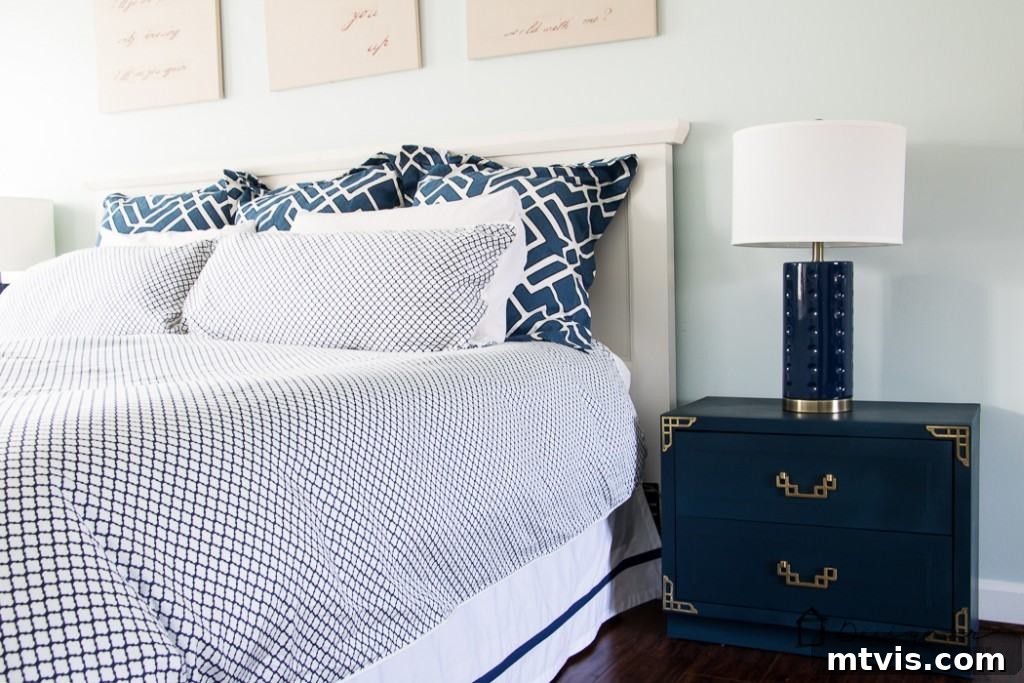 Campaign Nightstand Revival 7 Another angle of the transformed campaign bedside table, showcasing the rich navy paint and polished brass.