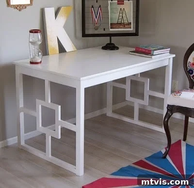 50 IKEA Hacks You Won't Believe Are IKEA 8 An IKEA Ingo desk, elegantly upgraded with decorative legs and a pristine white paint finish, takes center stage in a room. A prominent 'K' initial, along with other office paraphernalia, adorns the desk, showcasing a remarkable DIY IKEA hack.