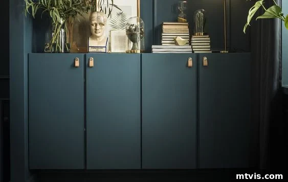 50 IKEA Hacks You Won't Believe Are IKEA 14 Elegant dark green built-ins integrated seamlessly against a matching dark green wall, expertly crafted from IKEA Ivar cabinets. The credenza is tastefully adorned with an array of books, thriving plants, and captivating art, creating a harmonious and sophisticated display.