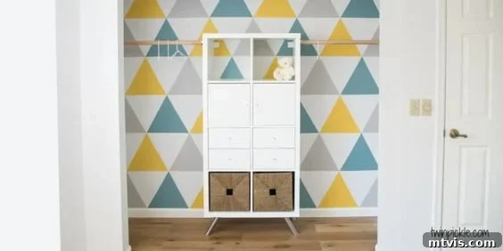 50 IKEA Hacks You Won't Believe Are IKEA 34 A vibrant graphic wall featuring bold triangle patterns serves as a backdrop for an IKEA Kallax unit, strategically placed to provide additional storage. This creative arrangement showcases how stylish and functional DIY IKEA hacks can be.
