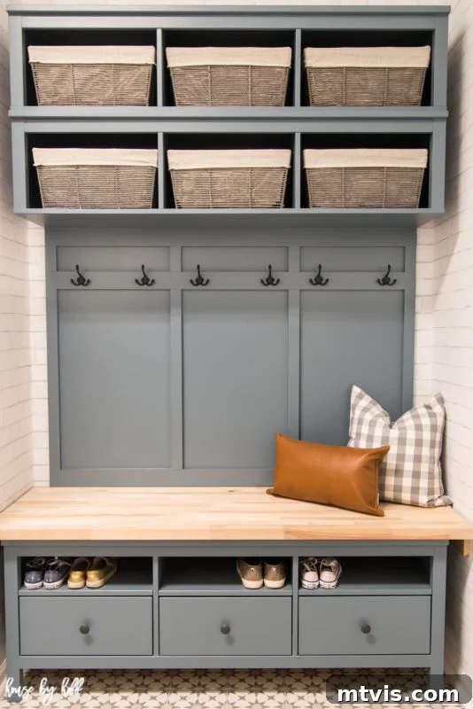 50 IKEA Hacks You Won't Believe Are IKEA 39 A contemporary grey mudroom bench, cleverly crafted from IKEA Hemnes drawers and cubbies, topped with a sturdy butcher block surface. Two decorative pillows adorn the bench, and fabric bins neatly line the shelves, all part of this functional and stylish DIY IKEA hack.