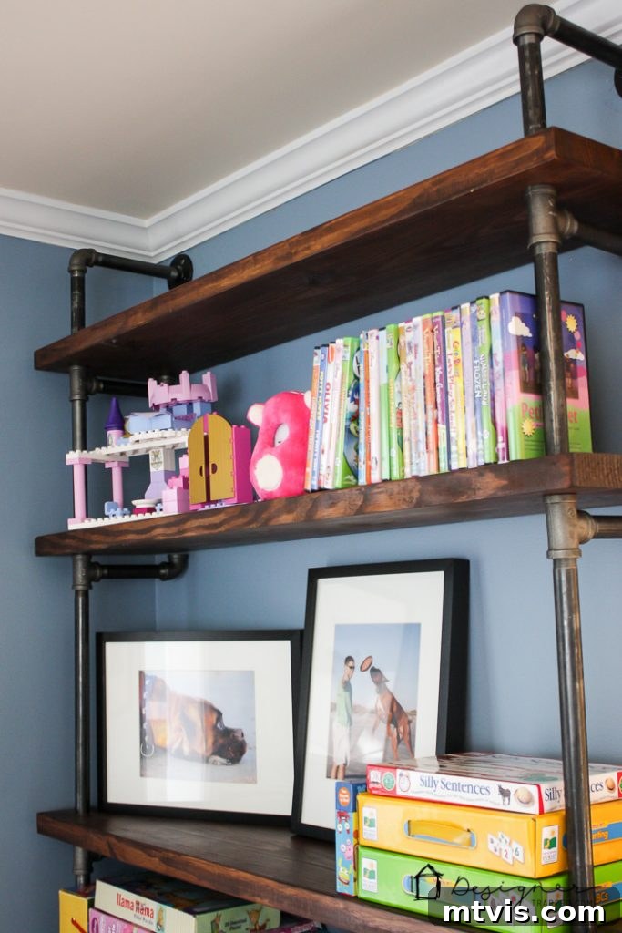 Playroom Paradise Unveiled 13 Close-up of the stylish and practical playroom decor, including a red metal storage basket for toys.
