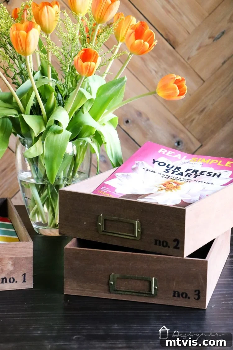 Craft Your Own Desk Organizers 9 A stylishly arranged stack of three personalized desk trays, labeled 'No. 1', 'No. 2', and 'No. 3', enhancing desk organization.
