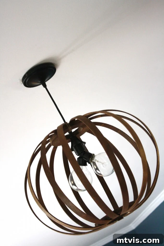 Create a High End Bentwood Pendant For Less 13 A close-up view of the DIY Bentwood Pendant Light showcasing its intricate wood details.