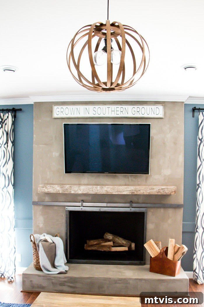 Elegant DIY barn door fireplace screen adding industrial charm