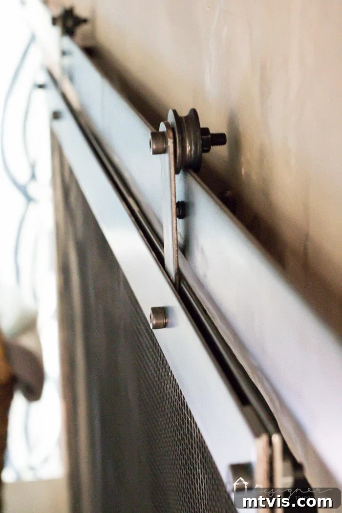 Barn door fireplace screen in open position revealing the firebox