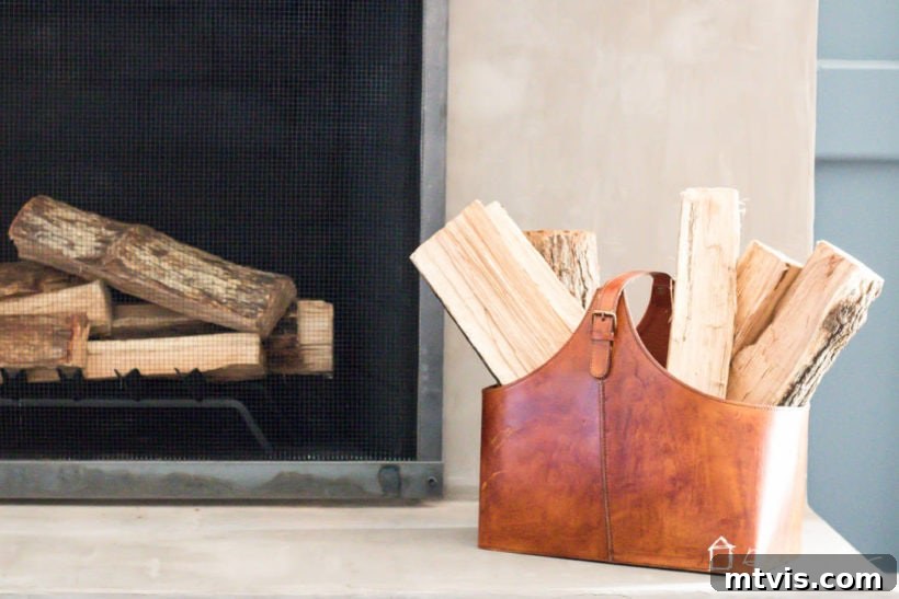Fireplace with barn door screen in a cozy living room setting