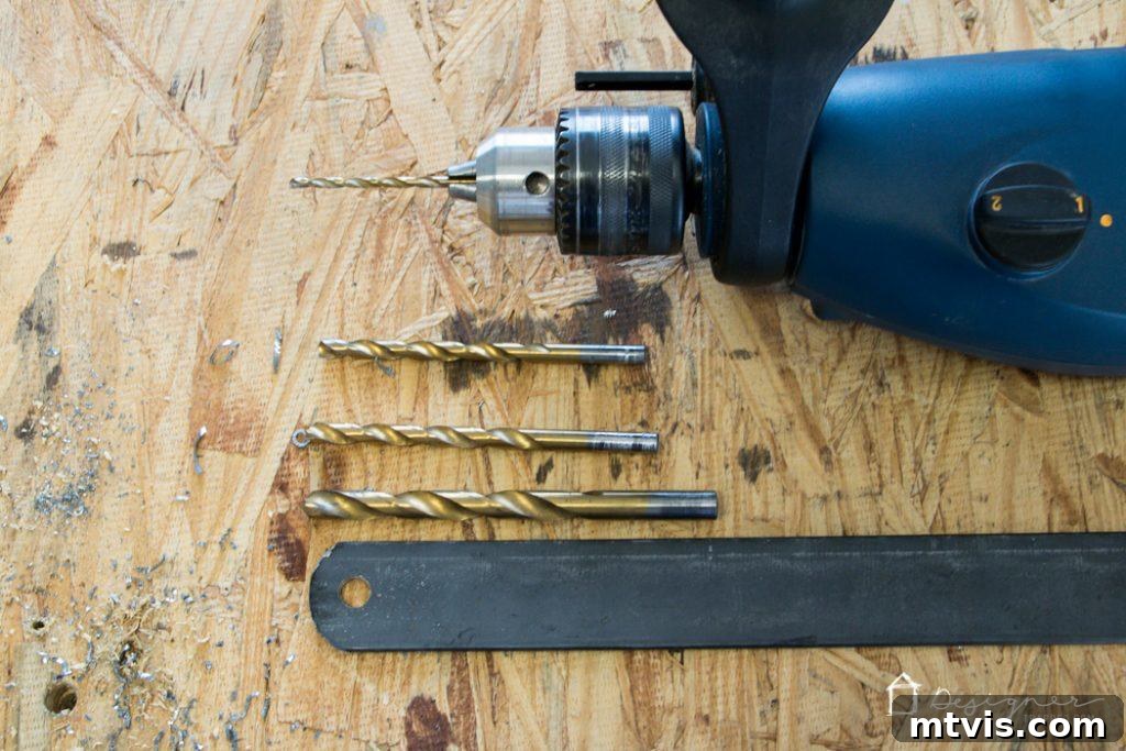 Various drill bits used for creating bolt holes in metal