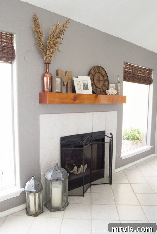 Build Your Own Driftwood Fireplace Mantel 2 Transform your living room with this DIY fireplace mantel update, featuring elegant molding and a beautiful driftwood finish.