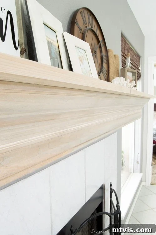 Build Your Own Driftwood Fireplace Mantel 11 The newly updated DIY fireplace mantel serves as a sophisticated focal point, blending seamlessly with the room's aesthetic.