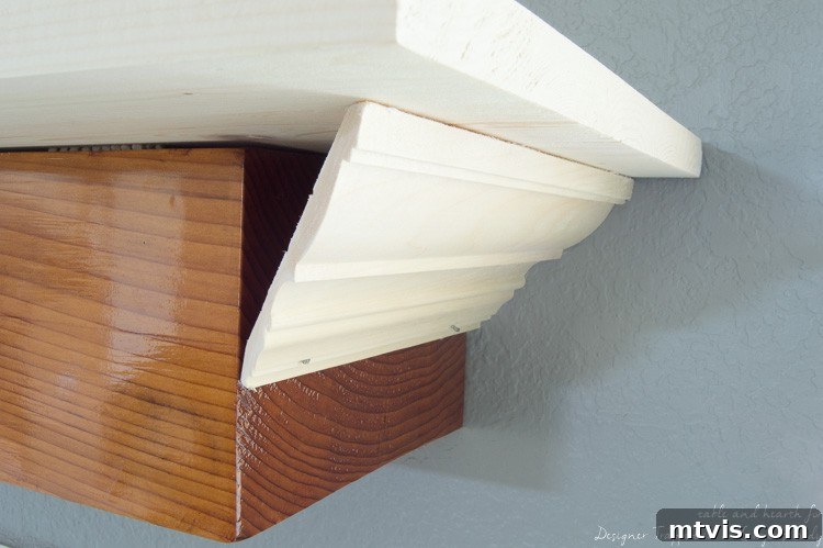 Build Your Own Driftwood Fireplace Mantel 6 Carefully dry-fit and then secure the crown molding with a brad nailer, ensuring snug, precise joints.