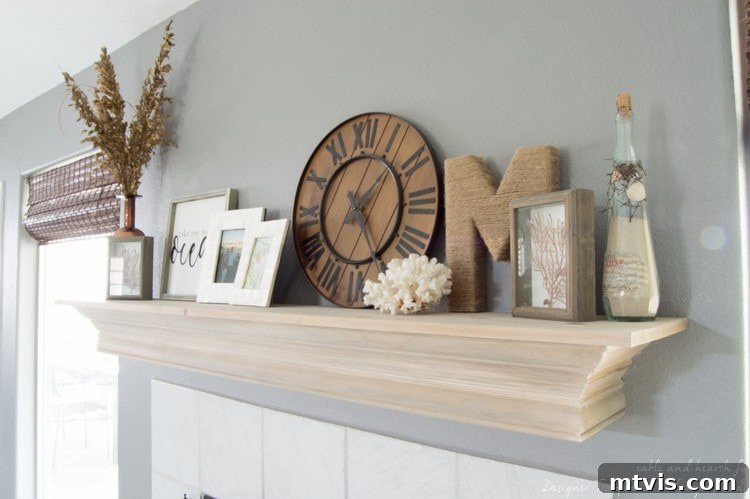 Build Your Own Driftwood Fireplace Mantel 9 The completed DIY fireplace mantel, now wider and featuring a beautiful driftwood finish, perfectly complements the coastal decor.