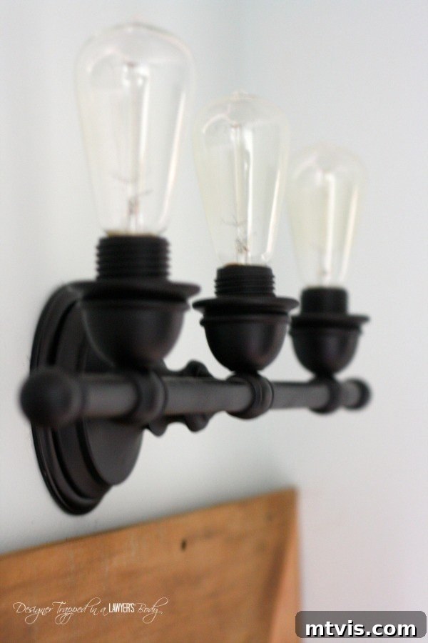 Spark Your Space: Creative DIY Lighting Projects on a Budget 3 Upcycled industrial light fixture made from an old vanity light