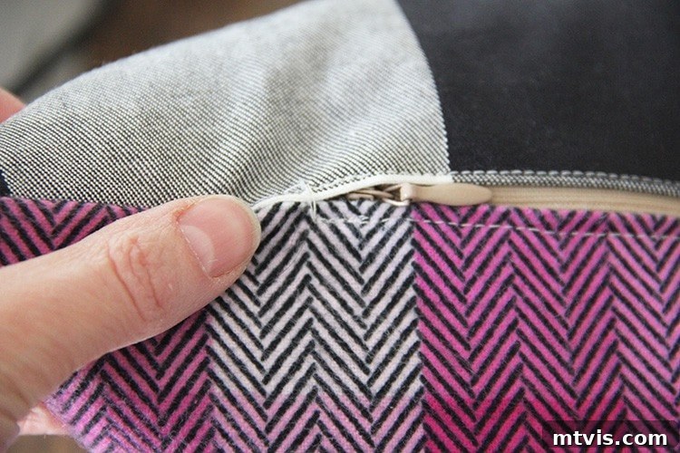 Sewing a Zippered Pillow Cover 15 Close-up of the completed hand stitching at the end of the zipper on the pillow cover.