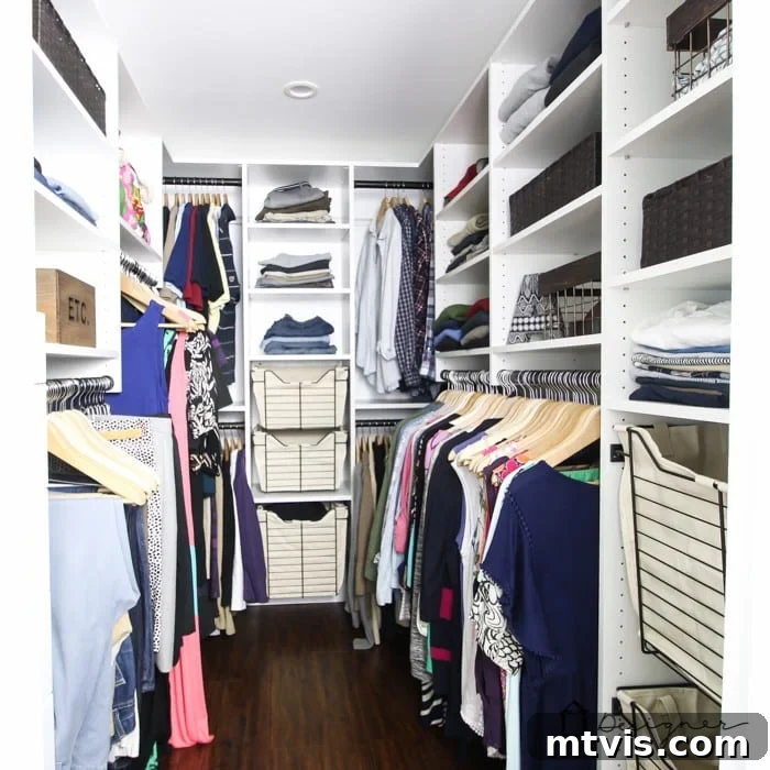 DIY Closet Makeover: Obsessed with the Results! 11 Our fully organized DIY closet system, showcasing neatly arranged clothes, shoes, and accessories in a functional and beautiful space.
