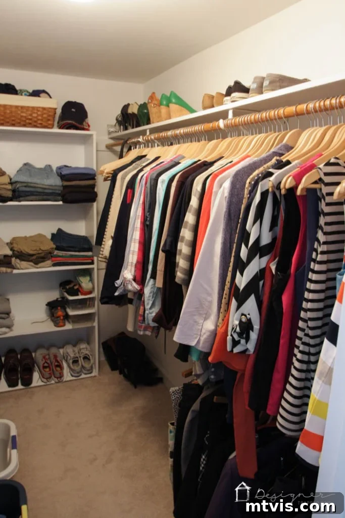 DIY Closet Makeover: Obsessed with the Results! 24 Before: Another angle of the disorganized closet, emphasizing the lack of defined storage solutions and wasted vertical space.