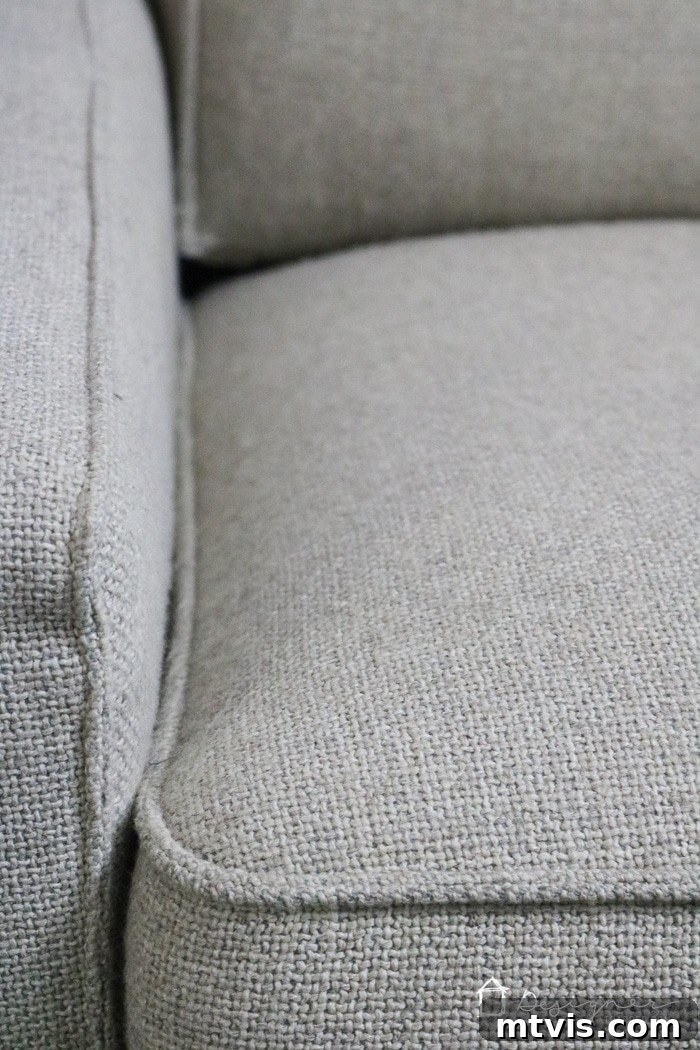 Sofa Transformation: Renew and Protect for Lasting Beauty 7 Full shot of the same living room couch after the complete makeover, presenting a clean, smooth, and refreshed appearance that significantly enhances the room's aesthetic. #revitalizedcouch #homedecorafter