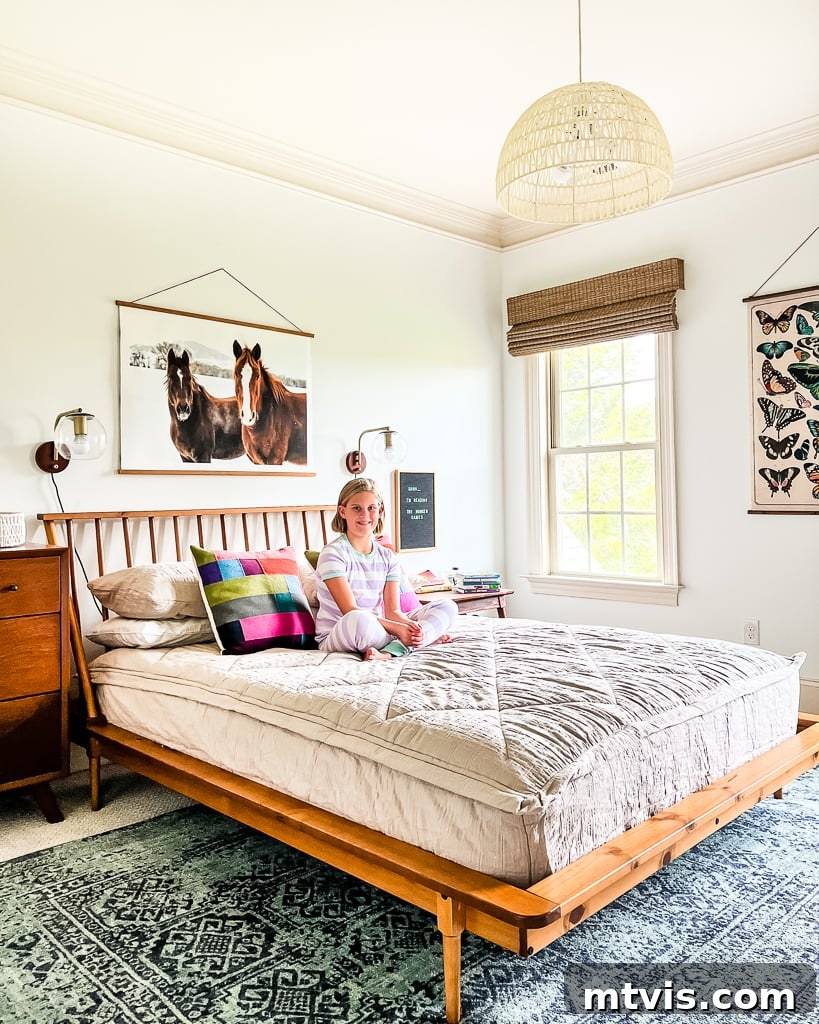 Girl relaxing on a bed with Beddy's bedding, a cool gift for teens