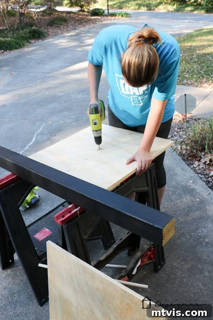 Painting the components of the DIY stocking holder stand black