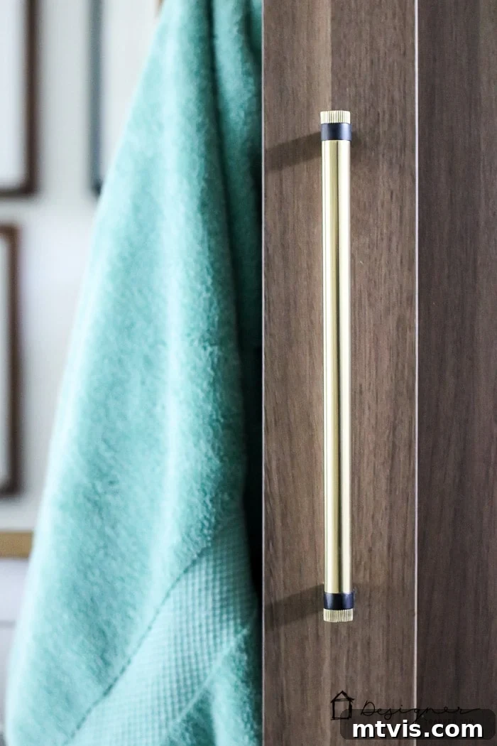 Showcasing the stunning cabinet and drawer hardware chosen for the DIY bathroom remodel, emphasizing how small details contribute to a cohesive and stylish design.