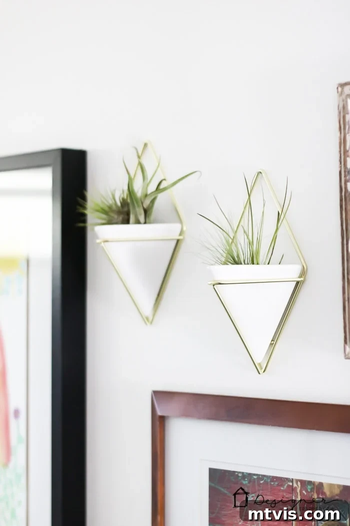 A wider view of the gallery wall, illustrating how a collection of diverse art pieces can transform a blank space into a focal point in a DIY bathroom remodel.