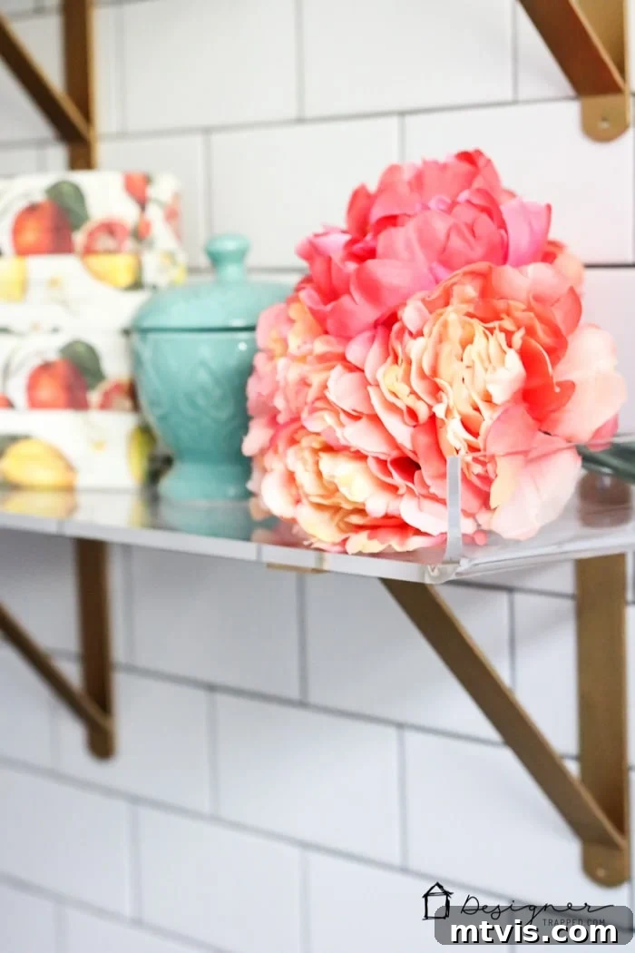 Close-up of the meticulous DIY subway tile work and the stylish decor elements, showcasing the quality and attention to detail in this homeowner-executed bathroom remodel.