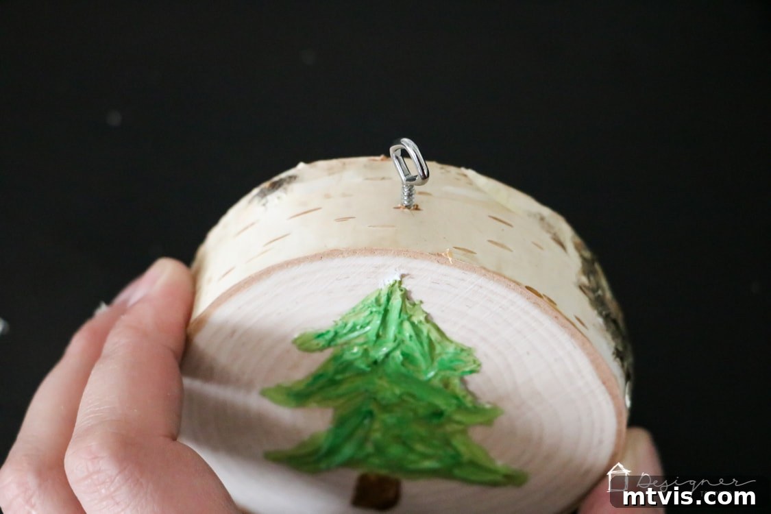 Create Stunning Textured Holiday Decor 9 Adding a screw eye to the top of the finished textured Christmas tree ornament for hanging.