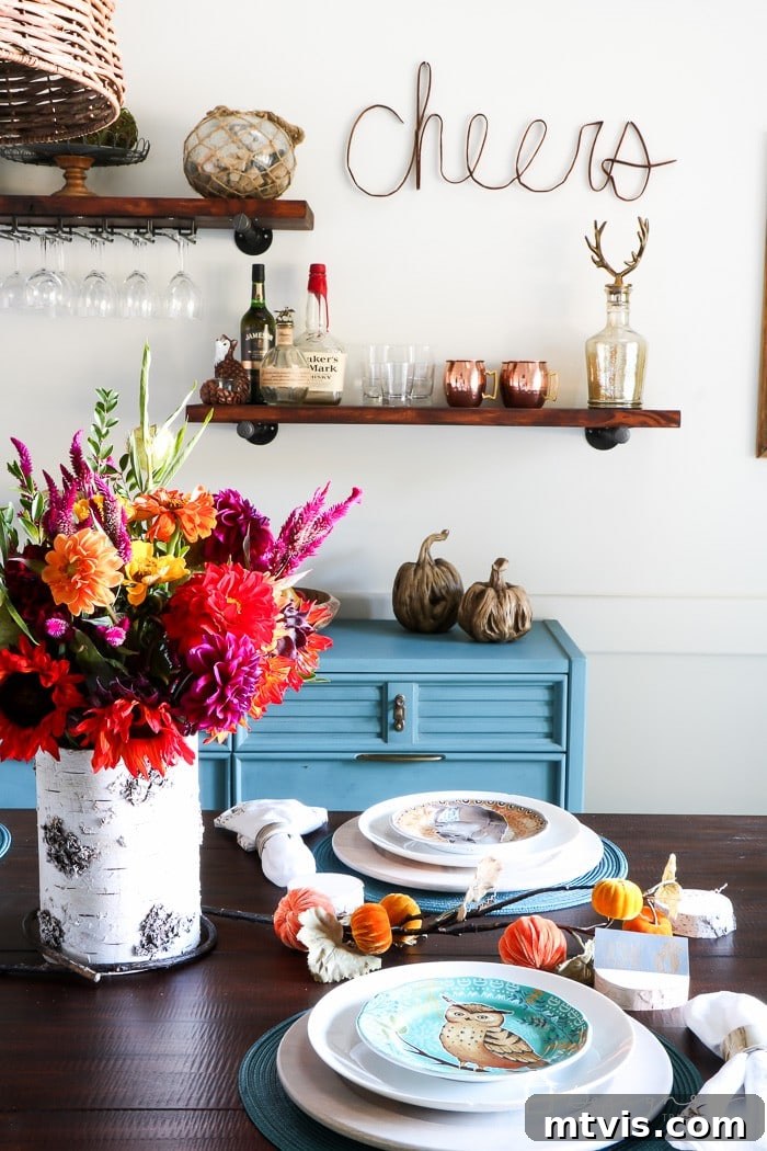 Your Ultimate Guide To Effortless Pipe Shelves 9 Detailed shot of the colorful dining room with custom pipe shelving