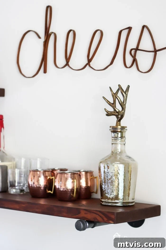 Your Ultimate Guide To Effortless Pipe Shelves 10 Pipe shelves decorated with shimmering copper Moscow mule mugs