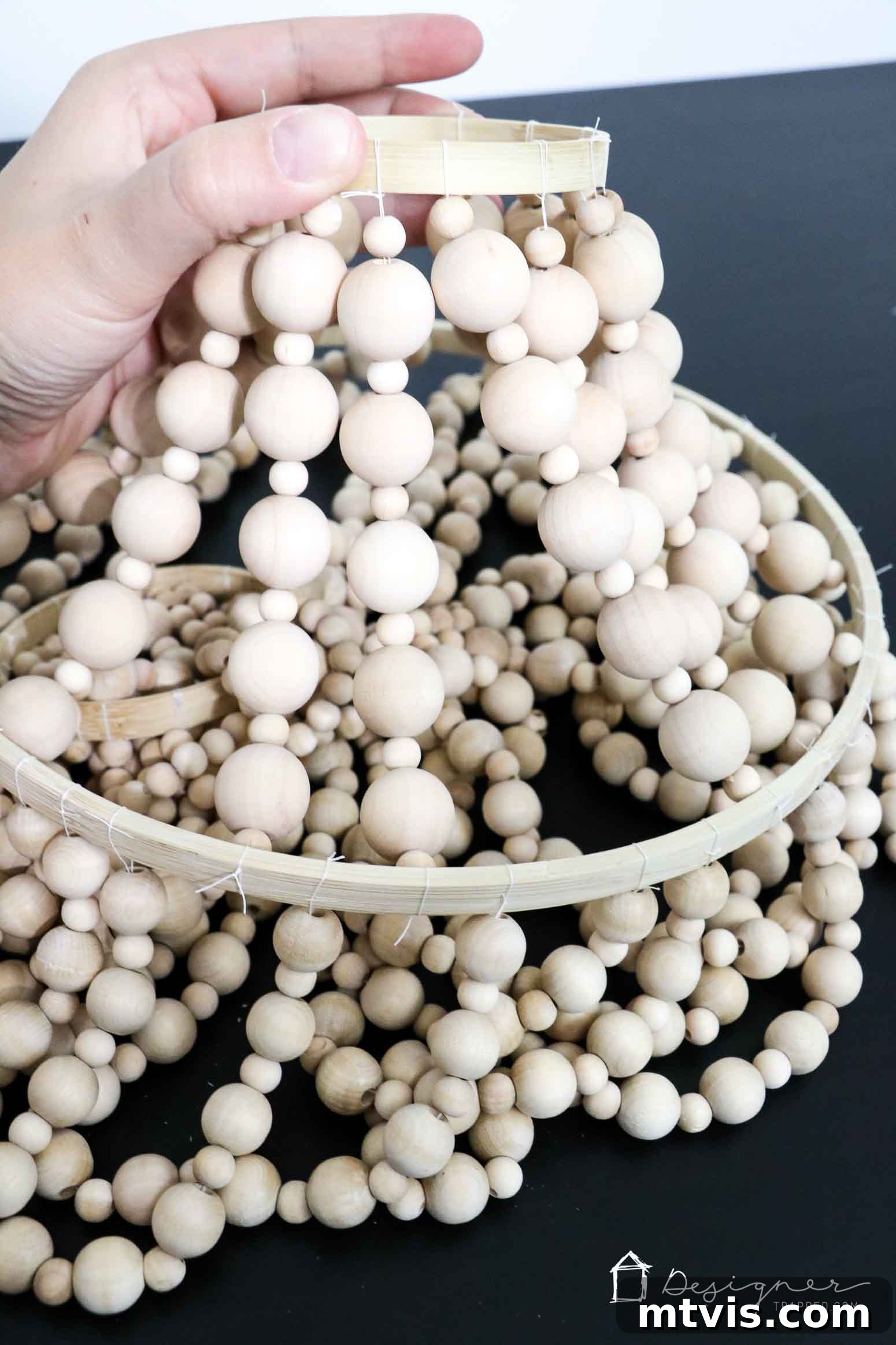 OMG, I love this DIY chandelier made from wood beads. It looks like it may take a while, but it doesn't look hard! I've wanted a wood bead chandelier but they are so expensive. Totally making this.
