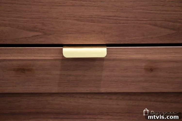 Ikea Cabinet Doors and Drawers Hack: Unlocking Custom Mounting Options 4 Close-up 'after' view of the filled holes on an Ikea cabinet door using epoxy putty, demonstrating a seamless repair ready for new hardware.