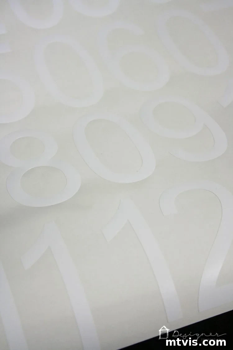 Chic Stair Risers: Elevate Your Home's Style 9 Weeding excess vinyl from custom cut numbers.