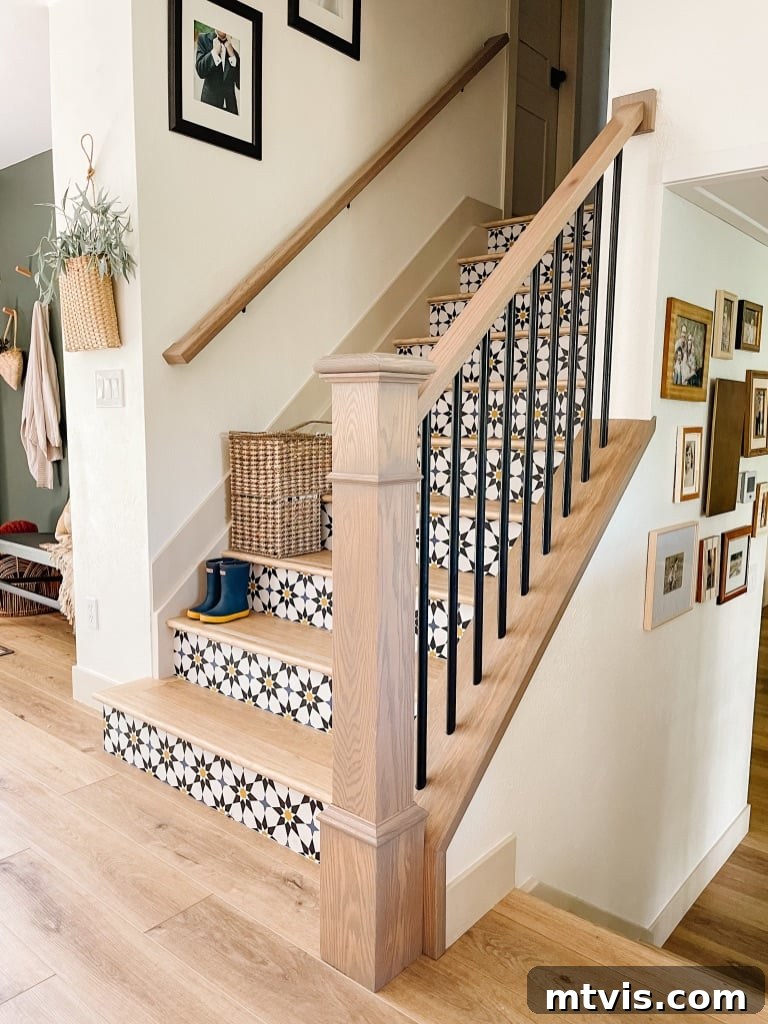 Chic Stair Risers: Elevate Your Home's Style 3 Staircase with graphic peel and stick wallpaper on risers, offering a bold design statement.