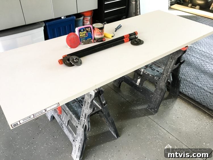 Preparing a hollow core door for an industrial DIY pipe desk, focusing on smoothing rough edges with wood filler.