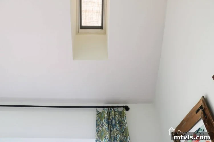 A bright, airy room featuring a modern VELUX skylight that blends seamlessly with the ceiling design.